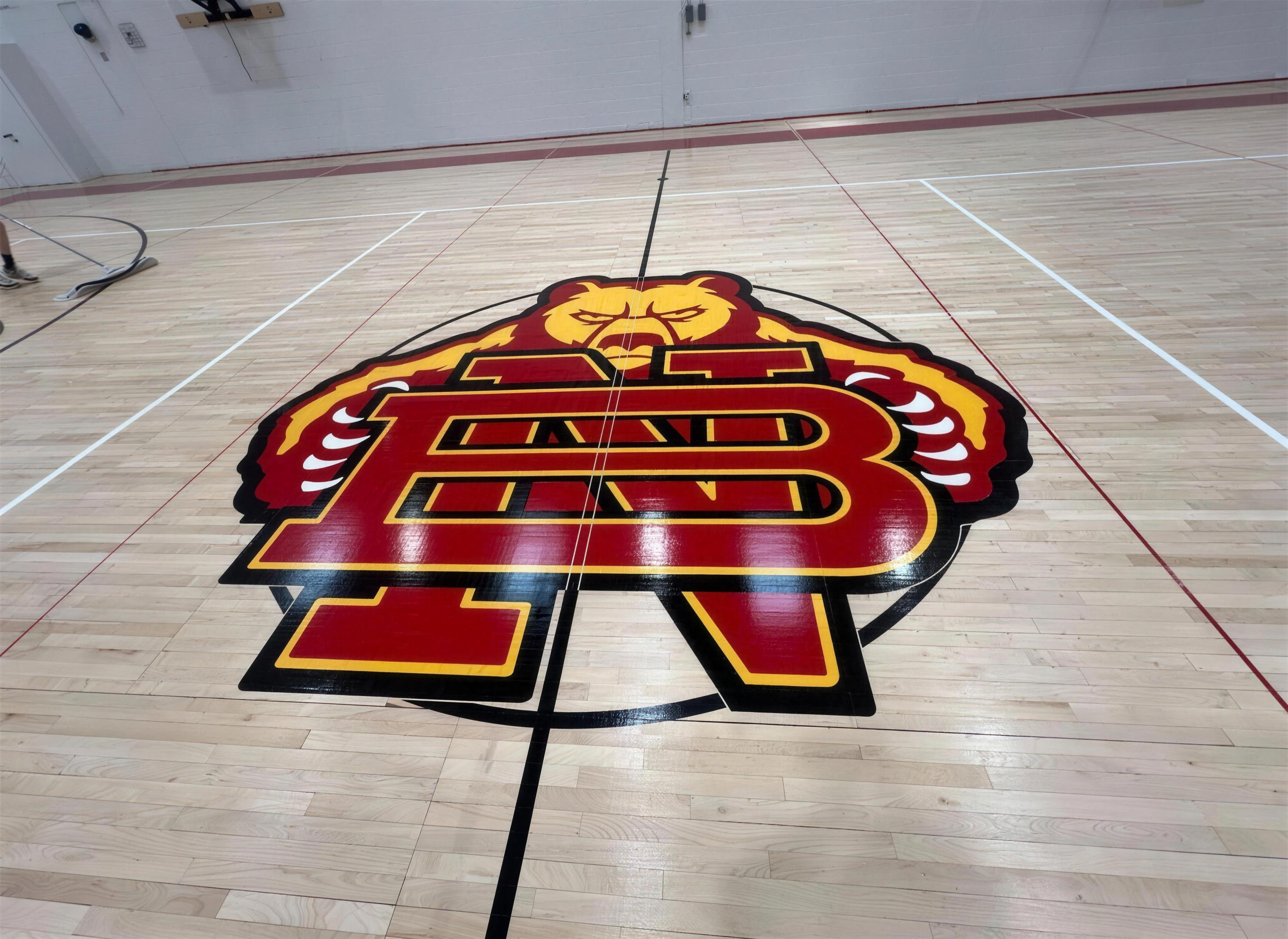 Gym floor logo install and recoat — after